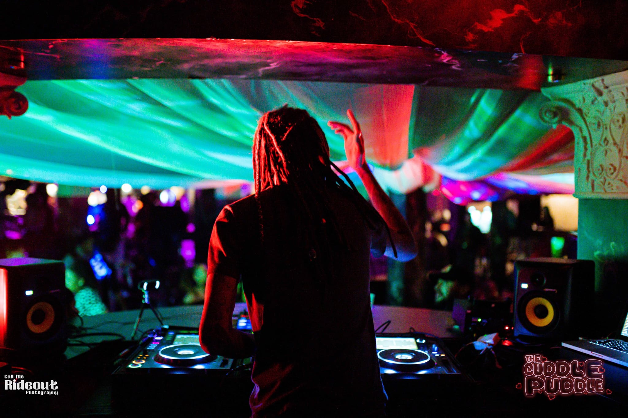 ChuckDiesel DJing behind the decks at a Cuddle Puddle show in Cincinnati